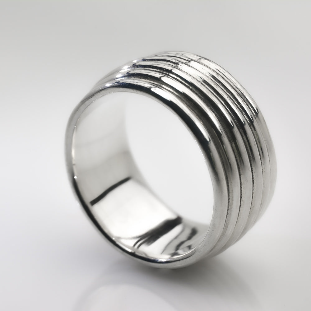 Revolutions: A Bold and Elegant Sterling Silver Ring with Six Loops