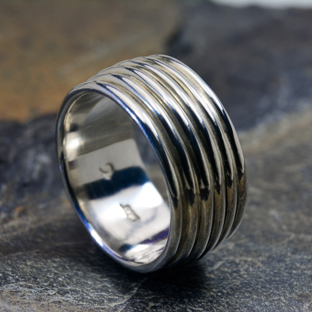 Revolutions: A Bold and Elegant Sterling Silver Ring with Six Loops - Nine Amulets 