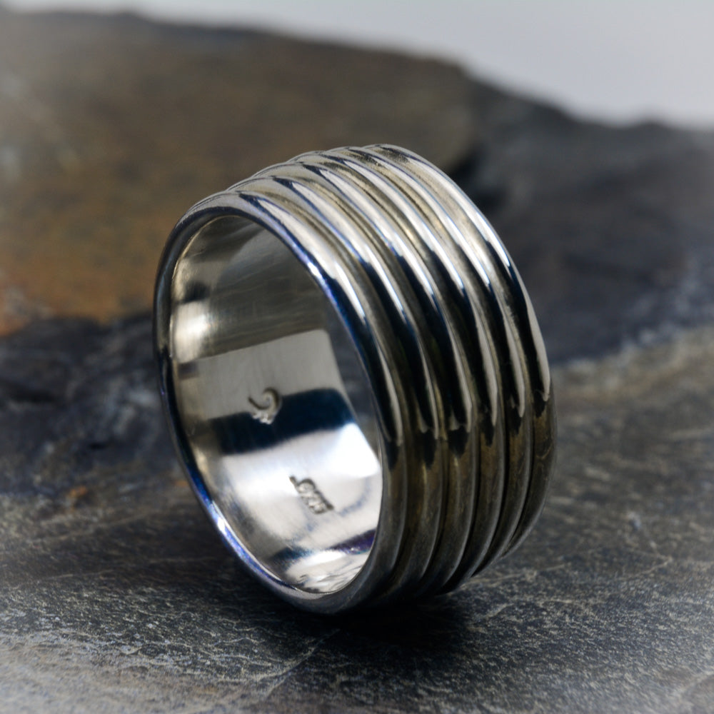 Revolutions: A Bold and Elegant Sterling Silver Ring with Six Loops