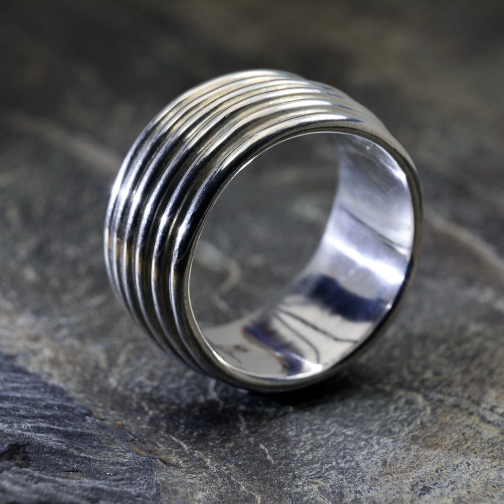 Revolutions: A Bold and Elegant Sterling Silver Ring with Six Loops - Nine Amulets 