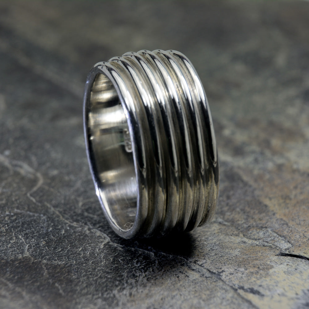 Revolutions: A Bold and Elegant Sterling Silver Ring with Six Loops - Nine Amulets 